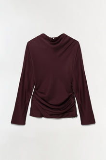 Burgundy satin long-sleeve top with draped neckline and ruched side detail.