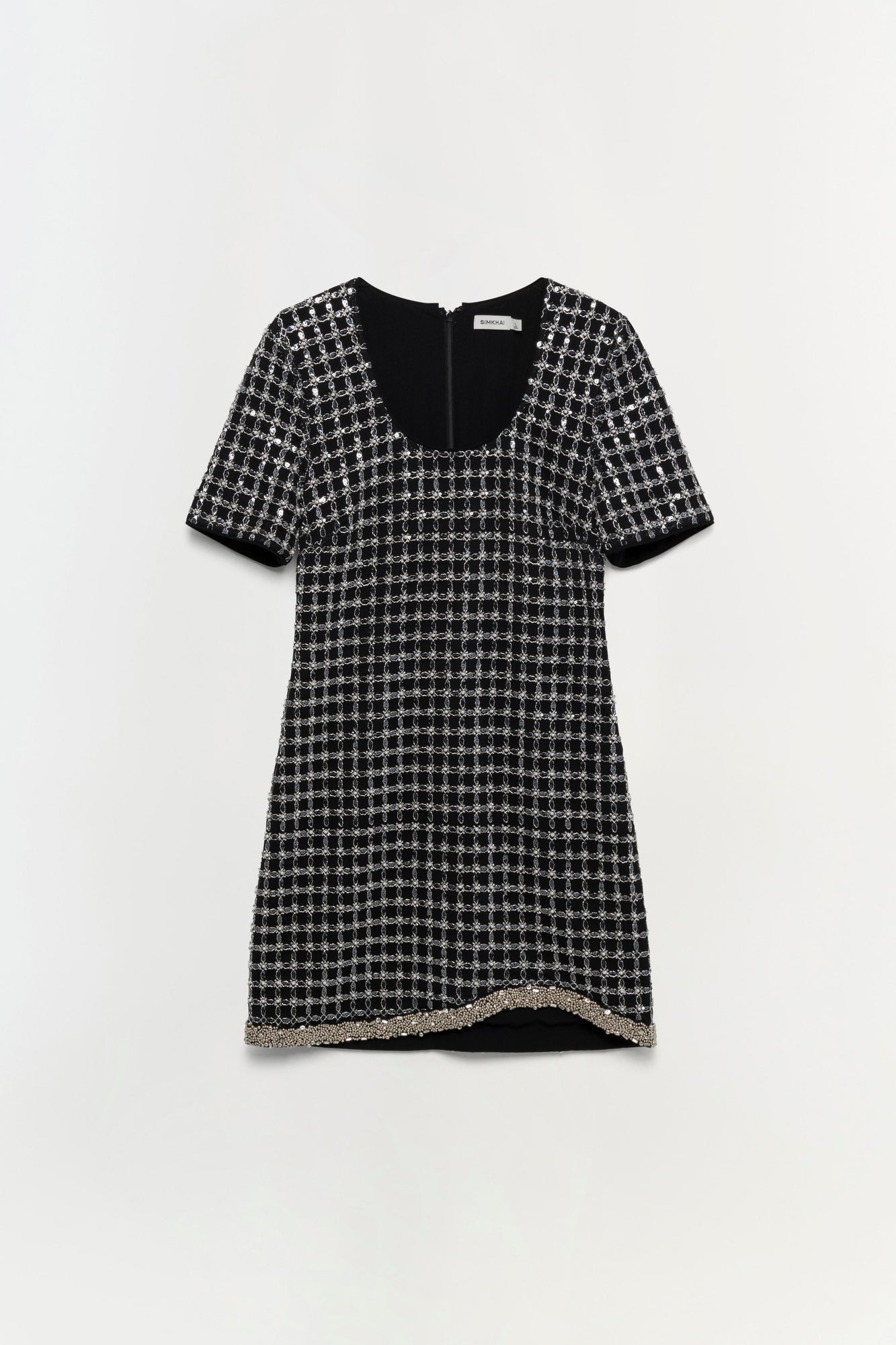Black tweed dress with short sleeves, square neckline, and metallic trim at the asymmetrical hem.