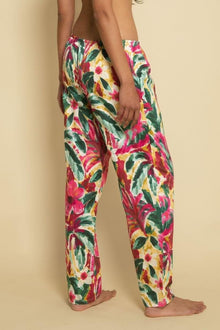 Wide-leg pants with red, yellow, pink, and green floral print and drawstring waist.