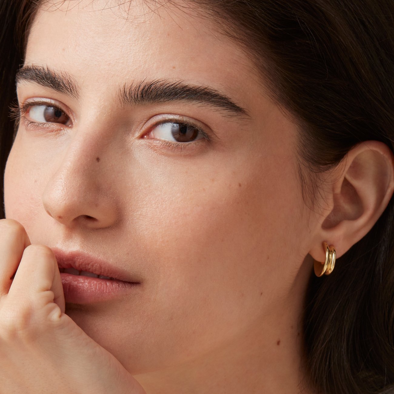 Small Hidden Heart Hoop Earrings in Gold on Model