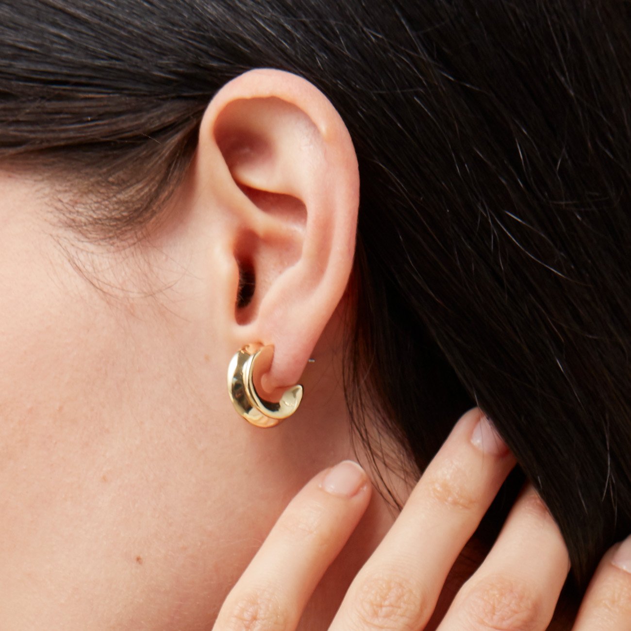 Small Hidden Heart Hoop Earrings in Gold on Model Close Up