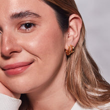 Small Hidden Heart Hoop Earrings and Small Toni Hinged Hoop Earrings in Gold on Model