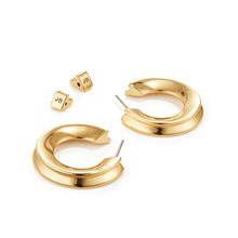 Hidden Heart Hoop Earrings in Gold Laying Flat on White Background