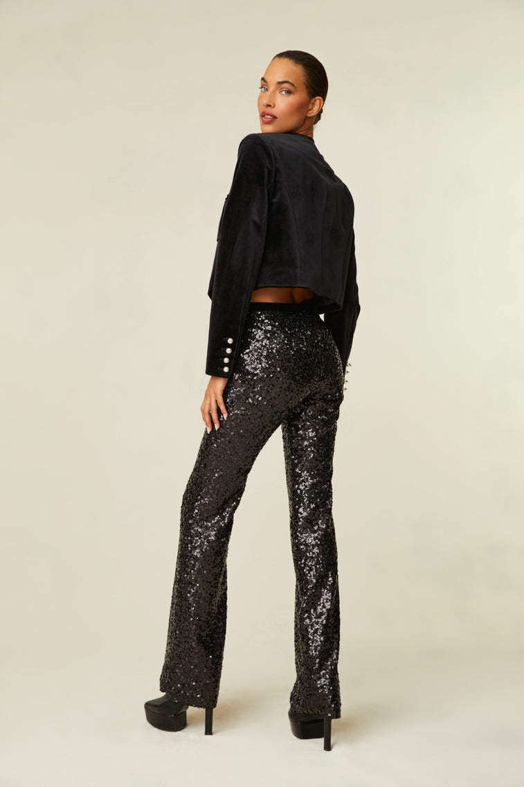 Sequin pants are a straight leg with a mid-rise fit and features a side zipper.