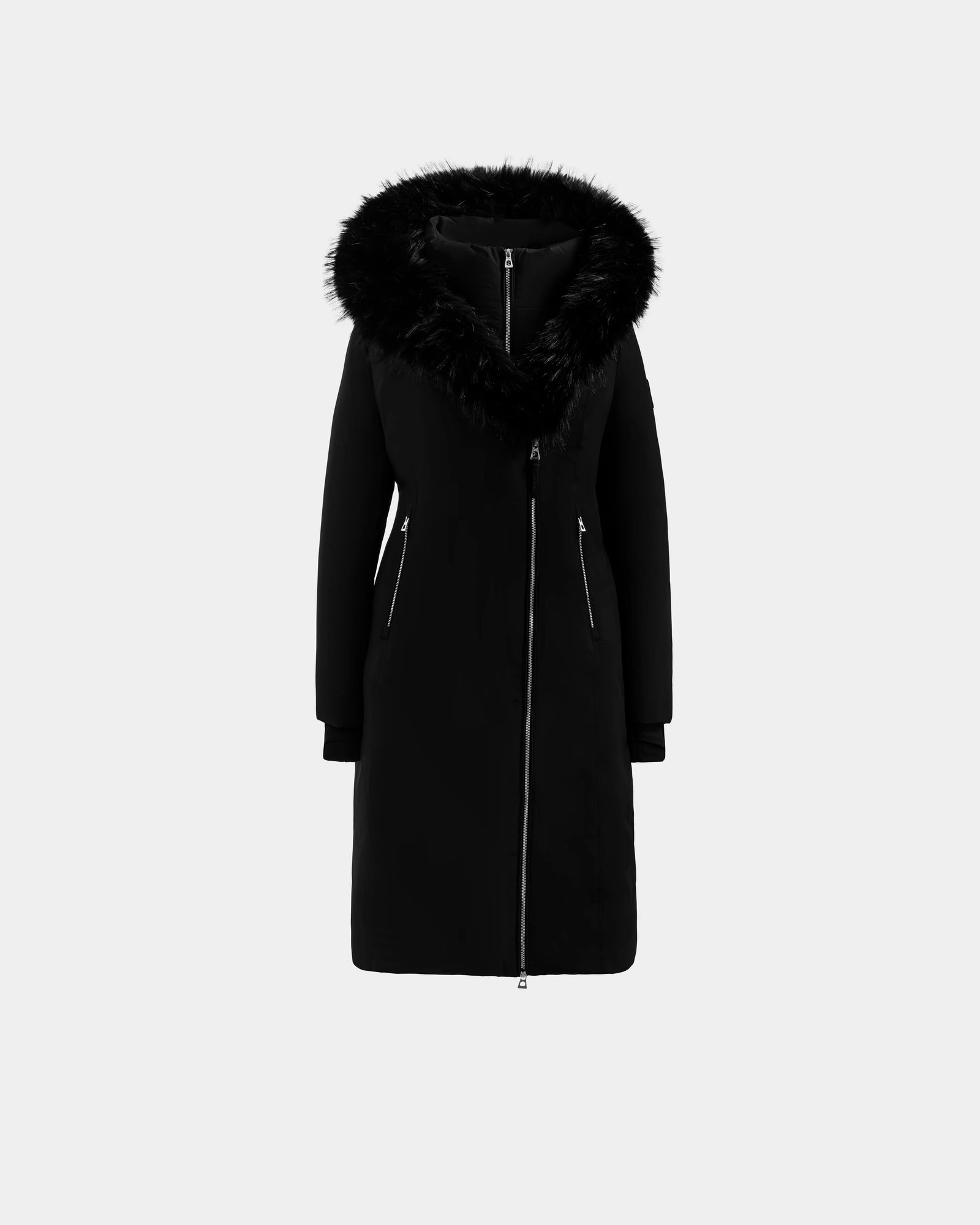 The Rudsak JANIS - L125558 Black is a long women’s down parka with a front zipper, two zippered side pockets, and a large faux fur hood, displayed on a plain light gray background.