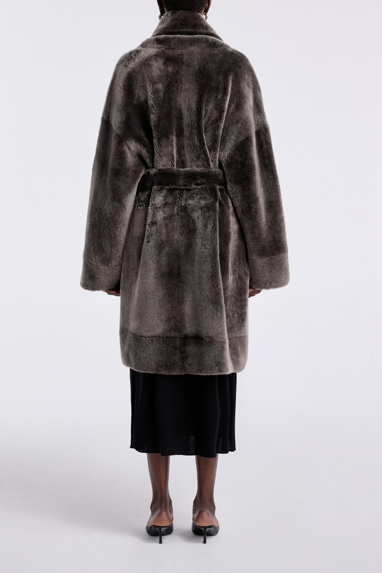 Model is wearing Nour Hammour Juno Luxurious Robe Coat Fumée - Back