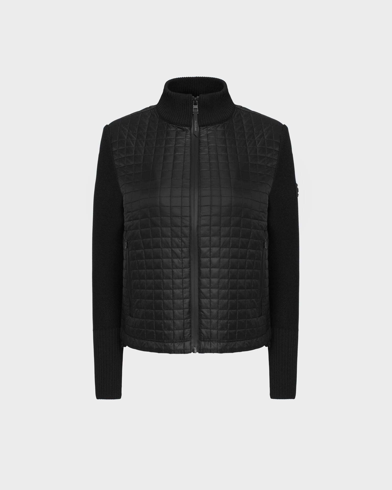 The LOUISE - 8124046 Black by Rudsak is a womens hybrid knit sweater jacket with quilted leather front and back, ribbed knit details, and a front zipper. This lightweight piece is shown against a plain white background.