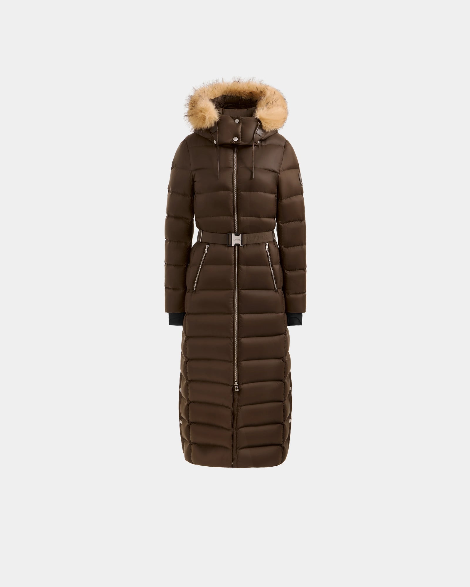 The Rudsak LILITH L - L125528 Espresso is a long brown down maxi puffer coat with a removable belt, front zipper, and faux fur-trimmed hood, shown against a plain white background.