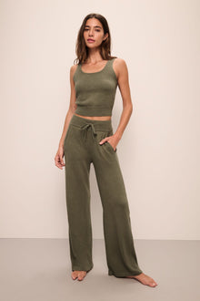 Model wears the Recycled Sweater Cropped Tank in Moss.