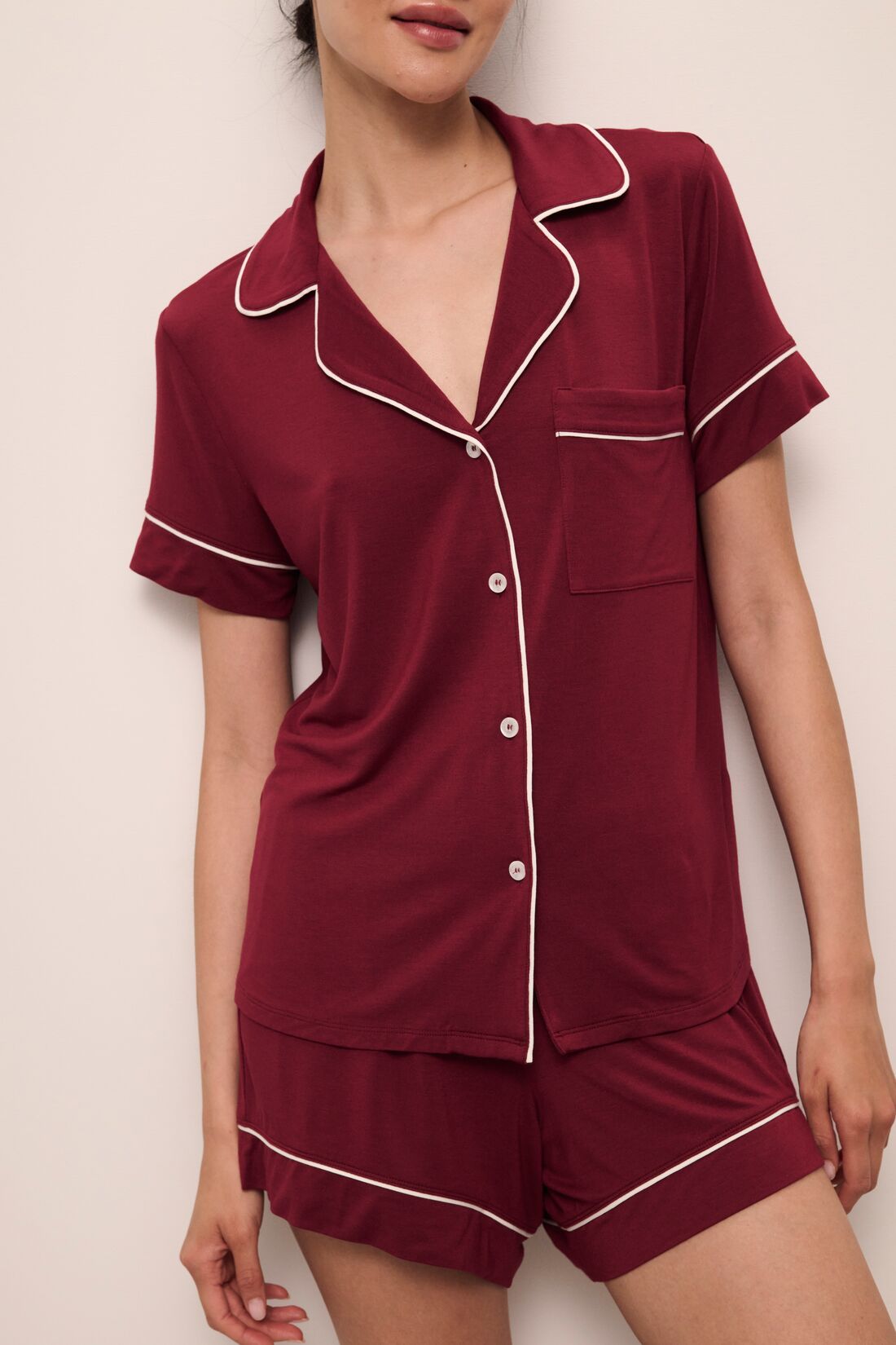 Model wears Gisele TENCELâ„¢ Modal Relaxed Short PJ Set in Cabernet/Ivory.