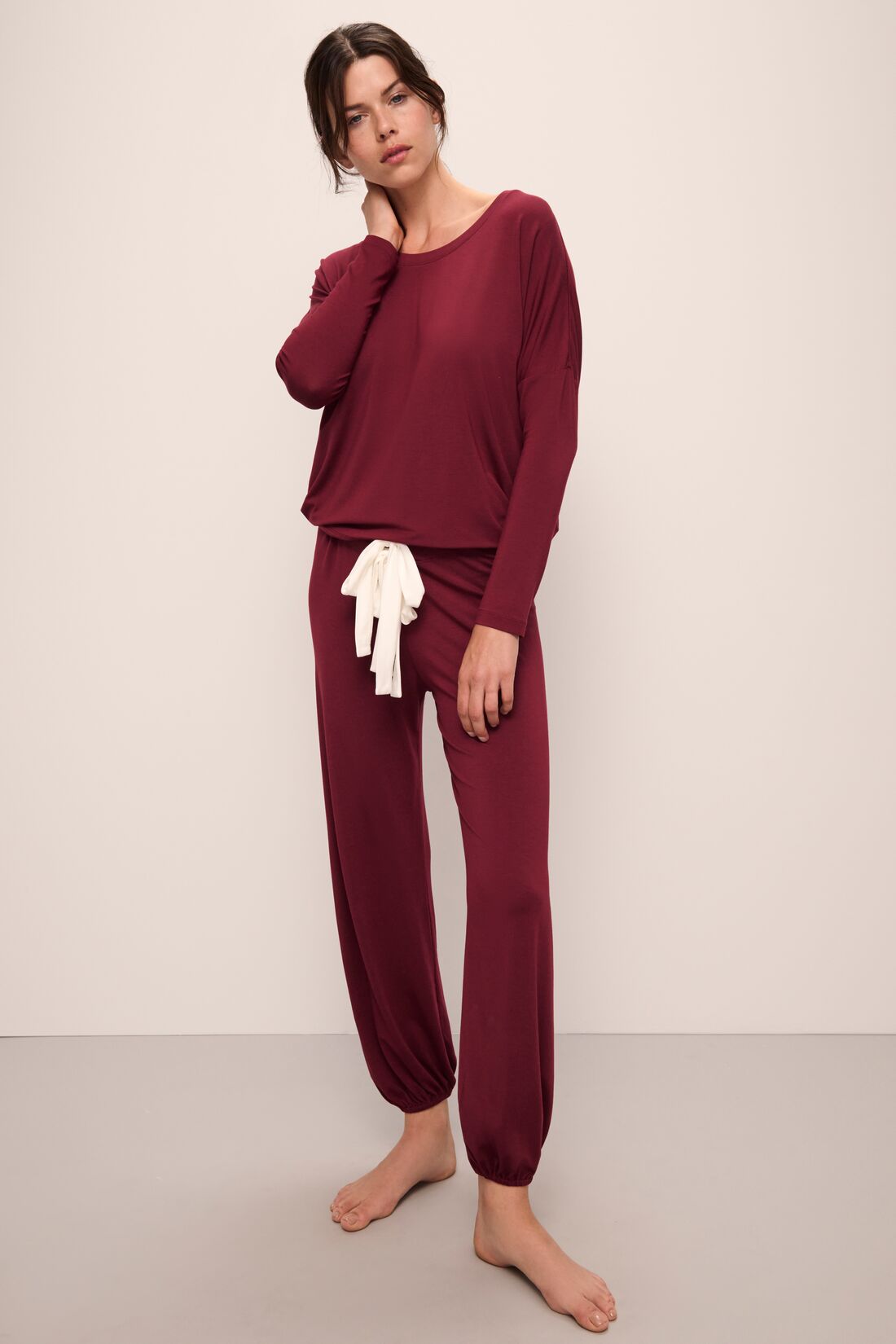 Model wears Gisele TENCELâ„¢ Modal Slouchy PJ Set in Cabernet/Ivory.