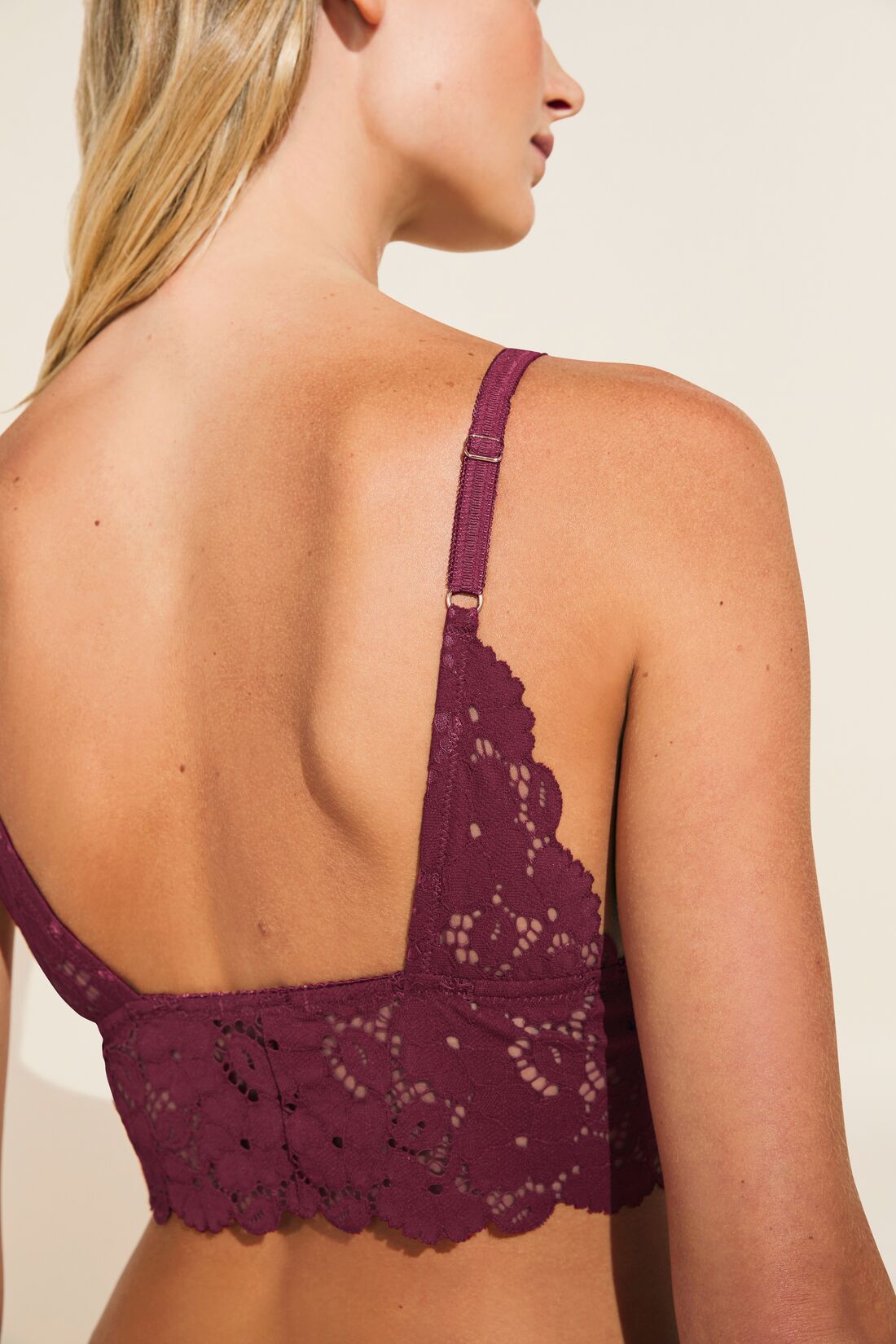 Model wears Naya Longline Bralette in mulberry.