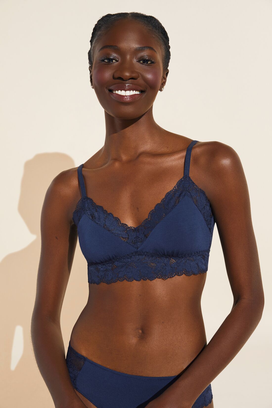 Model wears Rosalia TENCEL™ Modal Bralette in navy.