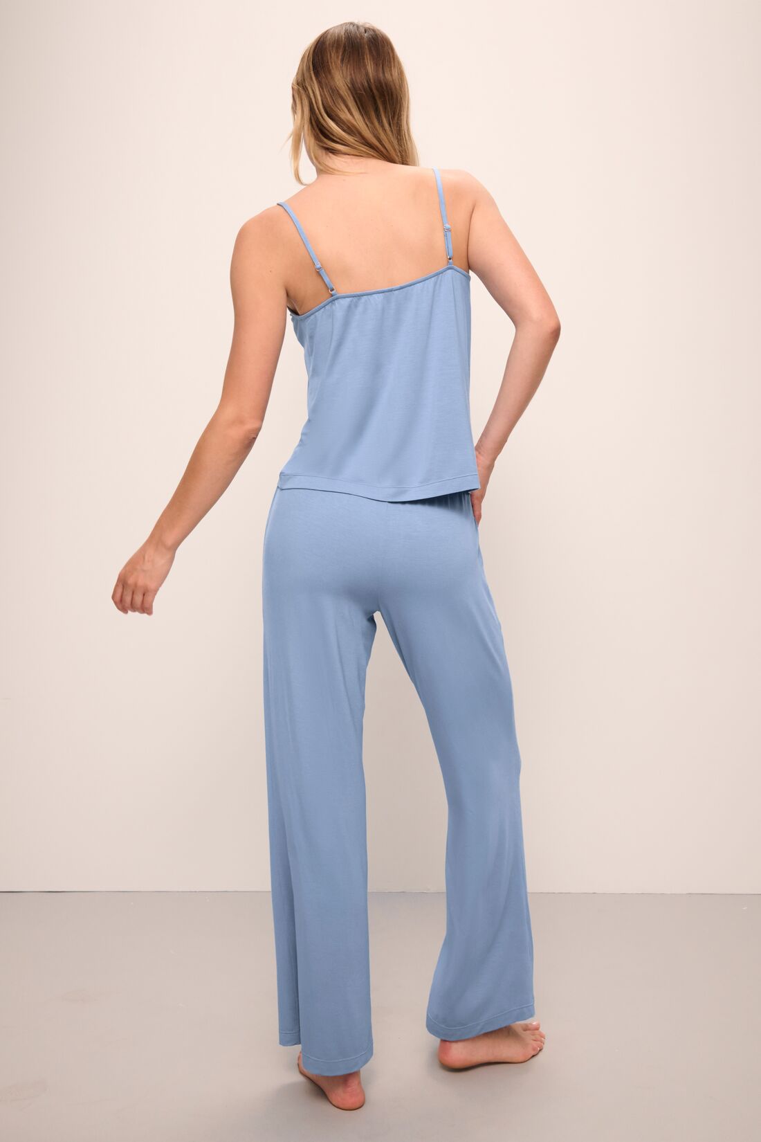 Model wears Gisele TENCEL Modal Cami & Pant PJ Set in wedgewood blue.
