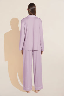 Model wears Gisele TENCELâ„¢ Modal Long PJ Set in lavender/ivory.