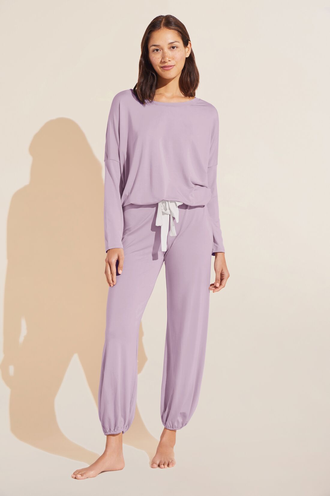 Model wears Gisele TENCEL Modal Slouchy PJ Set in lavender/ivory.