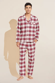 Model wears Mens Flannel Long PJ Set in red and ivory plaid.