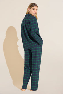 Model wears Flannel Long PJ Set in green and navy plaid.