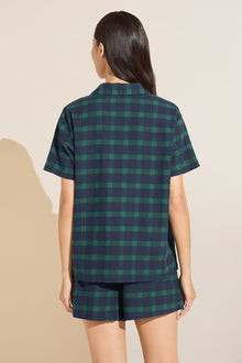 Model wears Flannel Short PJ Set in Navy and Green plaid.