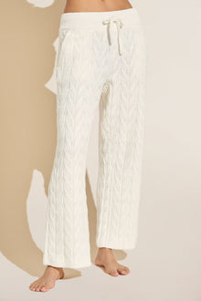 Model wears Cable Knit Recycled Sweater Straight Leg Pant in Ivory.