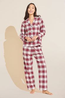 Model wears Flannel Long PJ Set in red and ivory plaid.