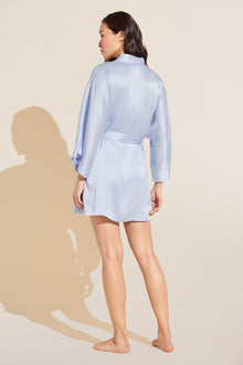 Model wears Inez Washable Silk Short Robe in powder blue.