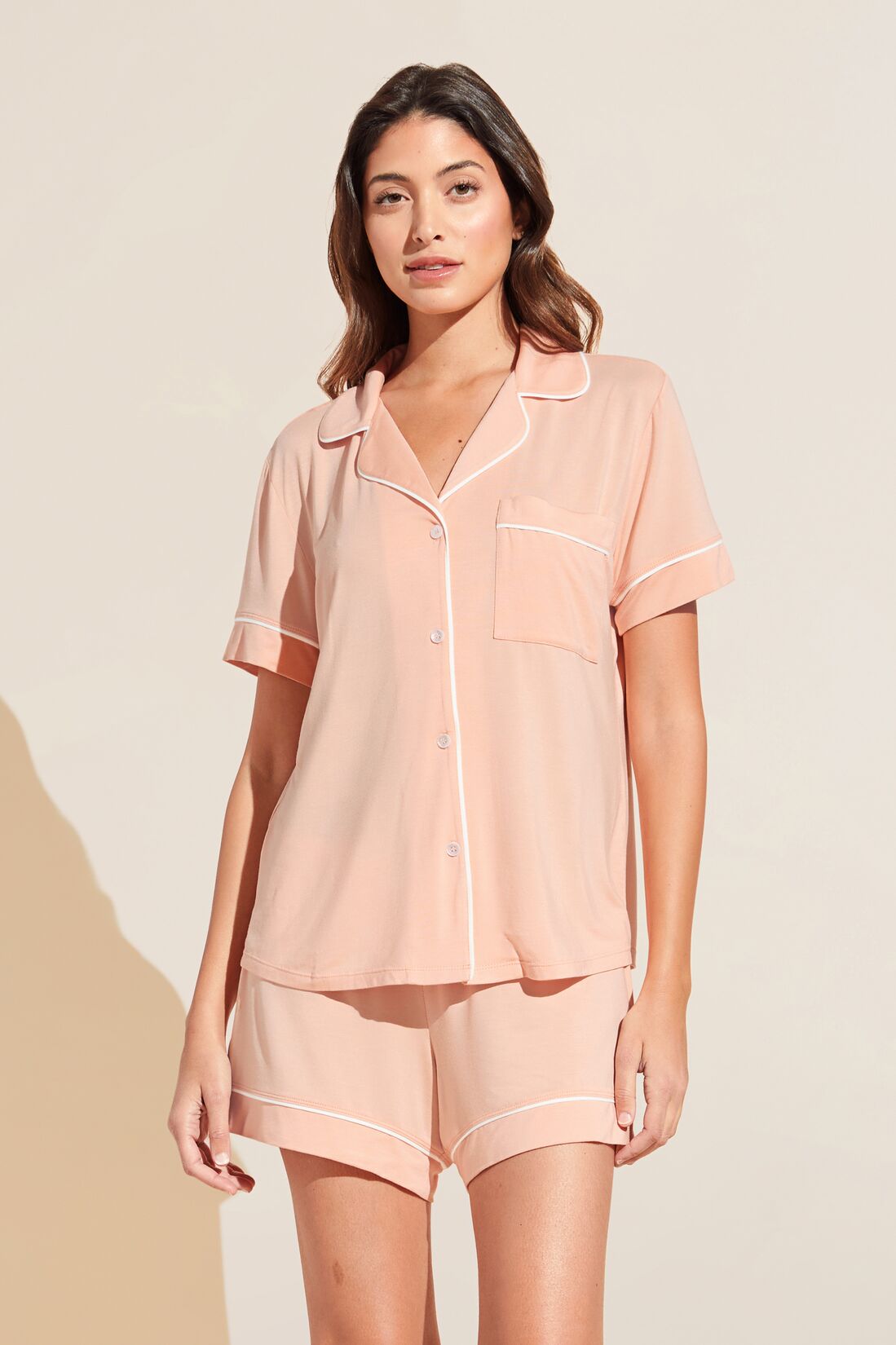 Model wears Gisele TENCEL™ Modal Relaxed Short PJ Set in peach parfait/ivory.