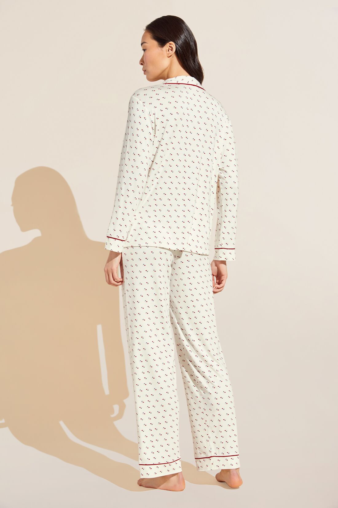 Model wears Gisele Printed TENCEL™ Modal Long PJ Set in triple heart print.