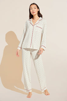 Model wears Gisele Printed TENCEL™ Modal Long PJ Set in triple heart print.