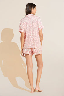 Model wears Gisele Printed TENCEL™ Modal Relaxed Short PJ Set in double diamond rouge pink print.