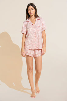 Model wears Gisele Printed TENCEL™ Modal Relaxed Short PJ Set in double diamond rouge pink print.