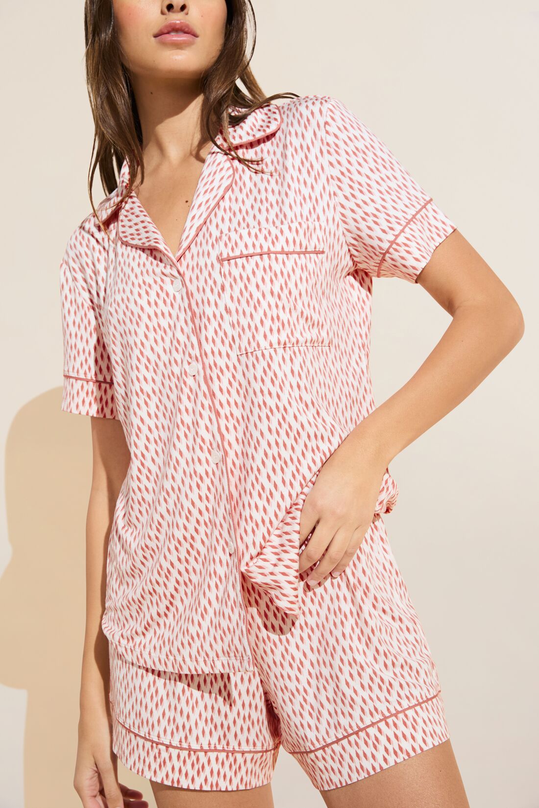 Model wears Gisele Printed TENCEL™ Modal Relaxed Short PJ Set in double diamond rouge pink print.