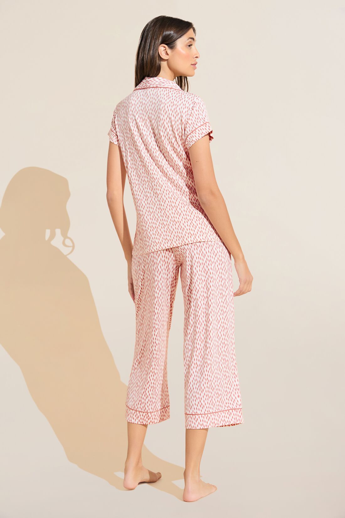 Model wears Gisele Printed TENCEL™ Modal Short Sleeve Cropped PJ Set in double diamond rouge pink print.