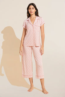 Model wears Gisele Printed TENCEL™ Modal Short Sleeve Cropped PJ Set in double diamond rouge pink print.