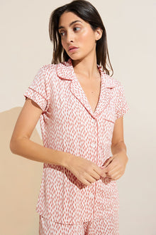 Model wears Gisele Printed TENCEL™ Modal Short Sleeve Cropped PJ Set in double diamond rouge pink print.