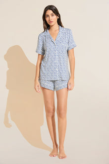 Model wears Gisele Printed TENCEL™ Modal Relaxed Short PJ Set in double diamond denim blue/ivory print.