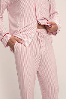 Model wears William Printed TENCELâ„¢ Modal Long PJ Set in Duo Stripe Haute Red/Haute Red.