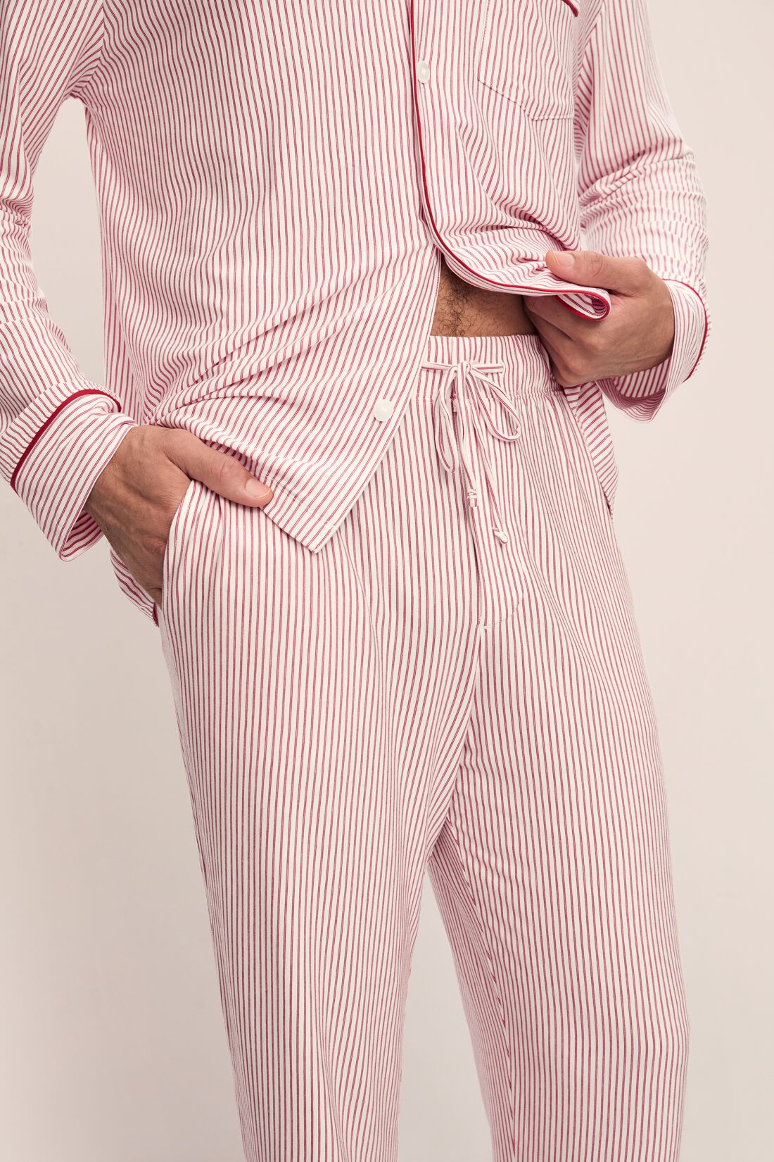 Model wears William Printed TENCELâ„¢ Modal Long PJ Set in Duo Stripe Haute Red/Haute Red.