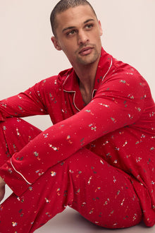 Model wears William Printed TENCELâ„¢ Modal Long PJ Set in Winter Wonderland Haute Red/Ivory.
