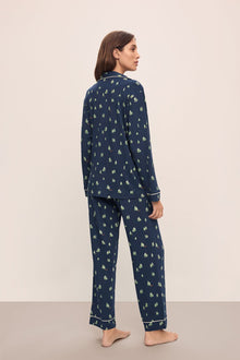 Model wears the Gisele Printed TENCELâ„¢ Modal Long PJ Set in Woodland Pine Navy/Ivory.