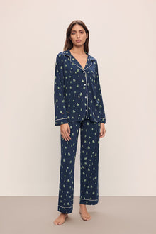 Model wears the Gisele Printed TENCELâ„¢ Modal Long PJ Set in Woodland Pine Navy/Ivory.