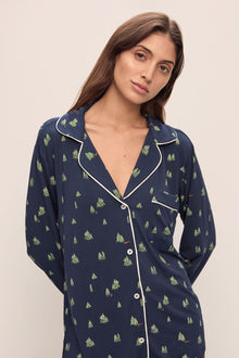 Model wears the Gisele Printed TENCELâ„¢ Modal Long PJ Set in Woodland Pine Navy/Ivory.