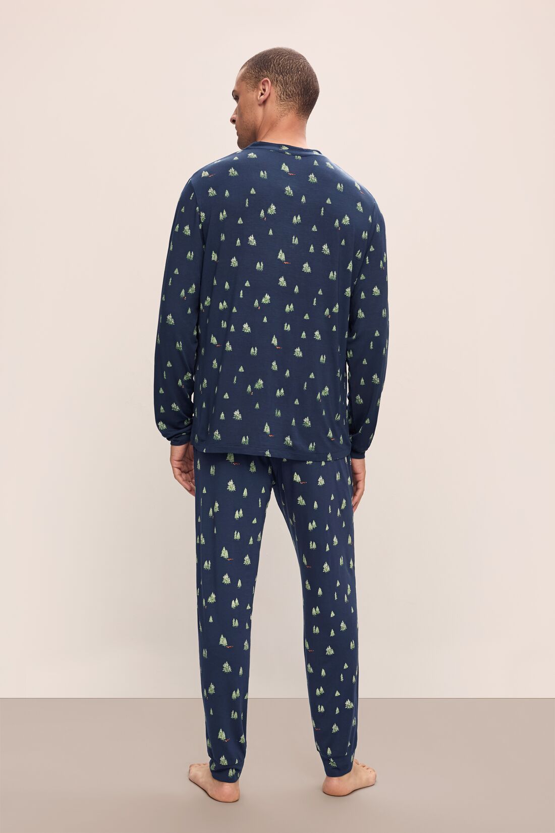 Model wears Henry Printed TENCELâ„¢ Modal Long PJ Set in Woodland Pine Navy/Ivory.