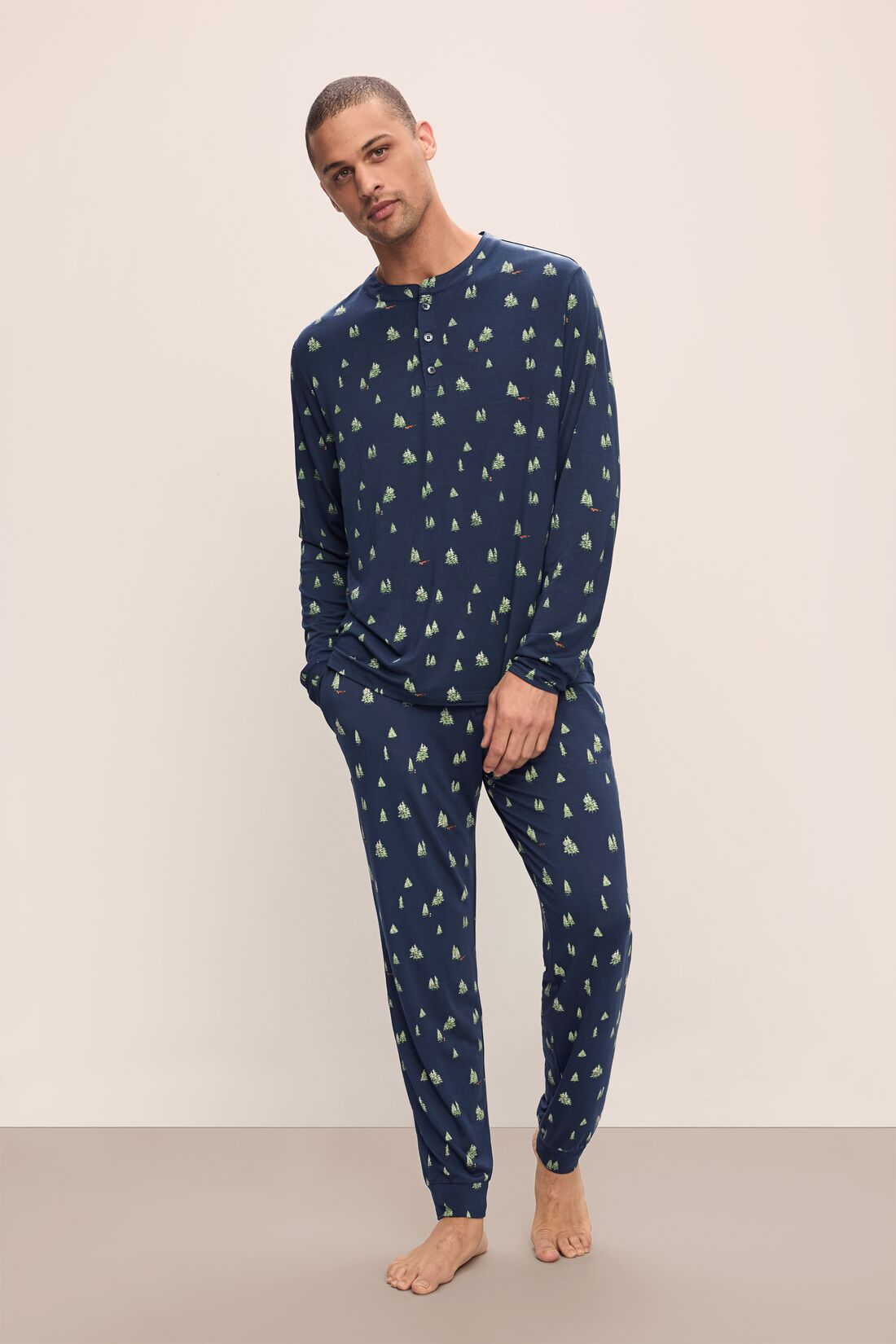 Model wears Henry Printed TENCELâ„¢ Modal Long PJ Set in Woodland Pine Navy/Ivory.