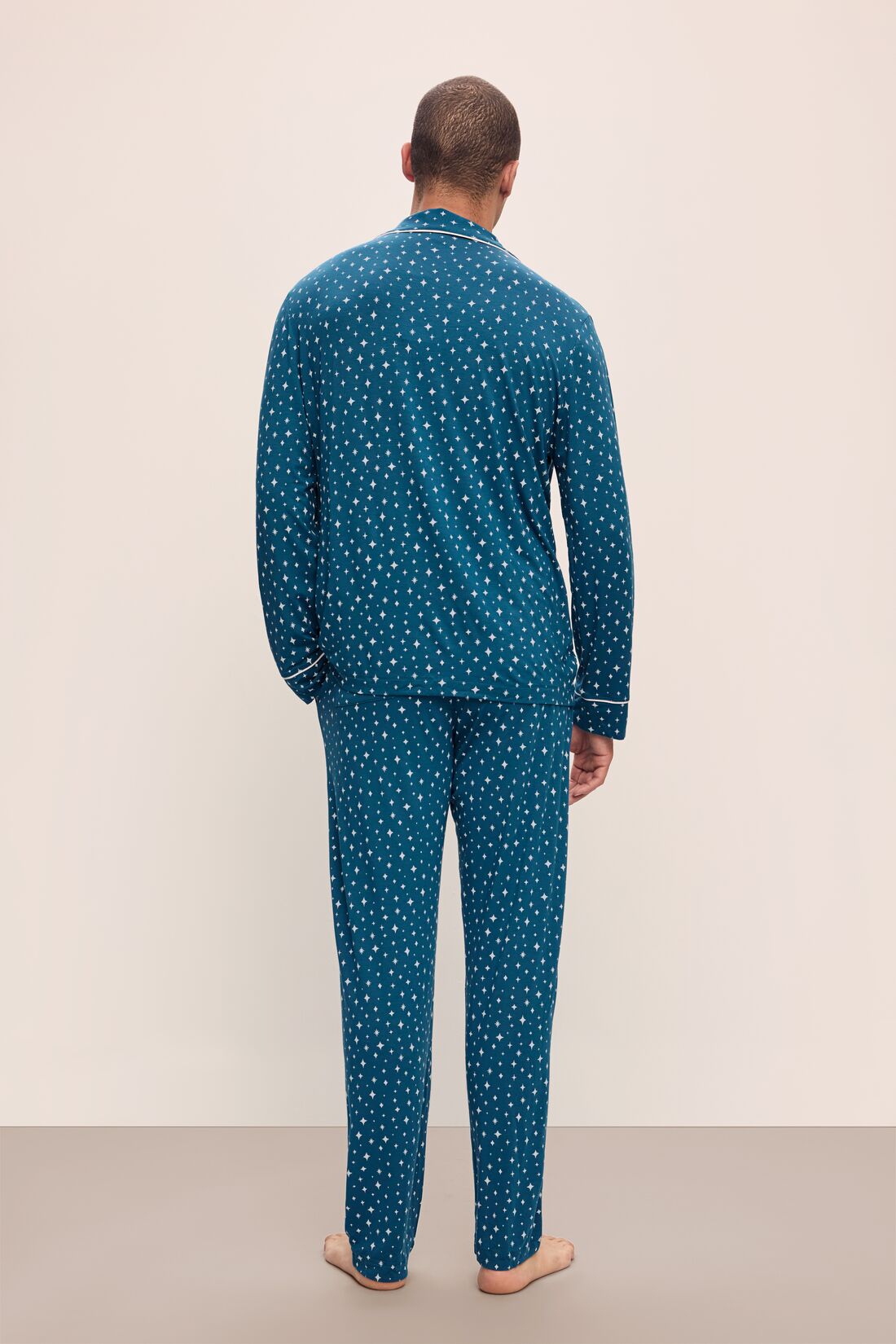 Model wears William Printed TENCELâ„¢ Modal Long PJ Set in Festive Lights Sapphire/Ivory.