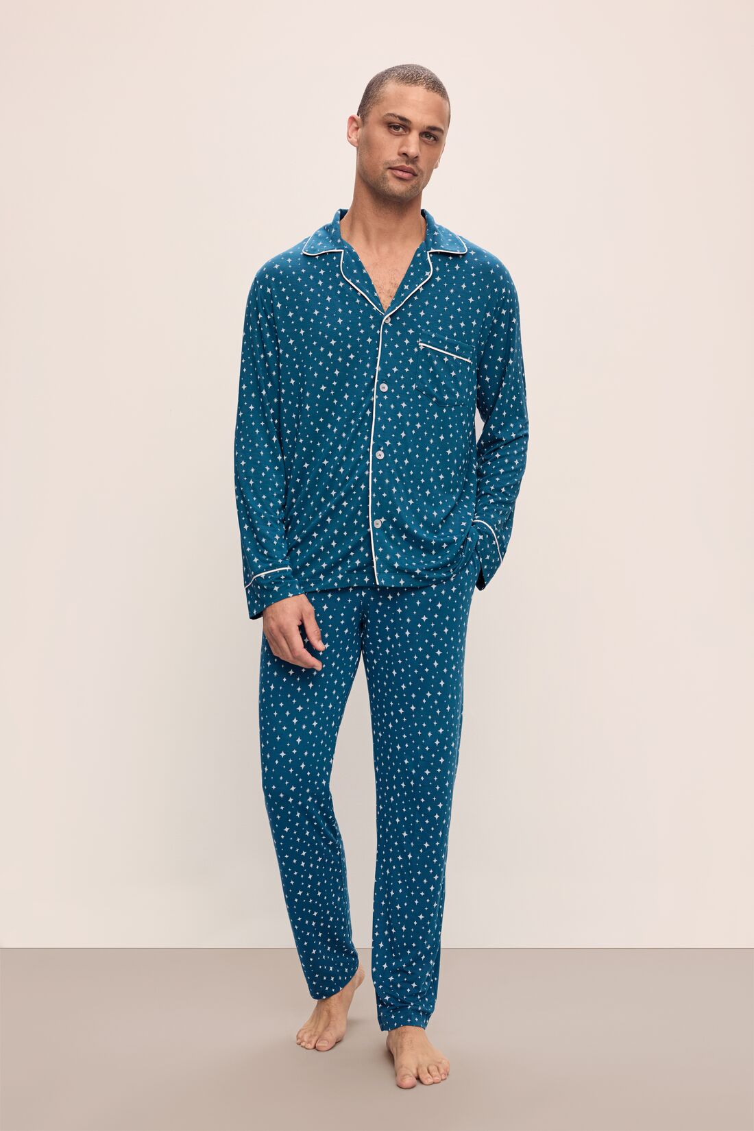 Model wears William Printed TENCELâ„¢ Modal Long PJ Set in Festive Lights Sapphire/Ivory.