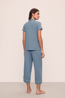 Model is wearing Gisele TENCEL Modal Short Sleeve Cropped PJ Set in Faded Denim/Ivory