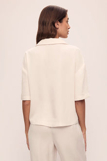 Model is wearing Tencel Woven Short Sleeve in Almond Heather