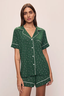Model wears Gisele Printed TENCELâ„¢ Modal Relaxed Short PJ Set in Winterpine Forest Green/Ivory.