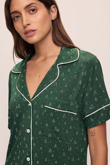 Model wears Gisele Printed TENCELâ„¢ Modal Relaxed Short PJ Set in Winterpine Forest Green/Ivory.